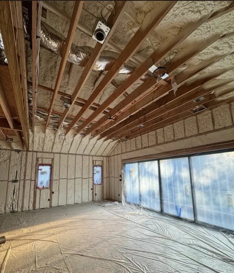 Interior walls and ceiling insulated with spray foam during new construction in La Quinta